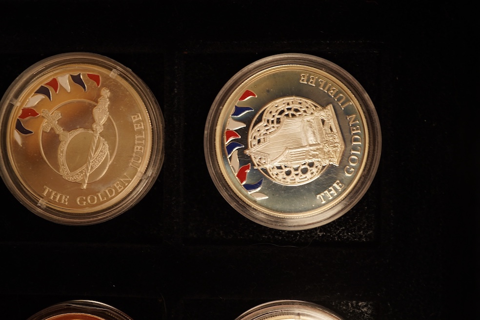Yorkshire Mint 'Royal Arms Collection' of 12 enamelled silver armorial shields, cased and Westminster Mint 12 QEII Falkland Islands Golden Jubilee proof silver coins, cased (2 cases)